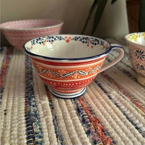 Colorful Ceramic Teacup with Red and Blue Patterns